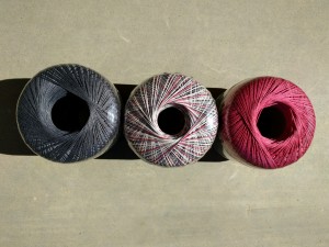 Artiste 100% Mercerized Egyptian Cotton size 10 crochet thread in Pewter, Terra Rosa; and Country Rose. I looove this gothic mix of colors.